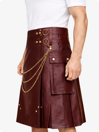 Burgundy leather kilt with gold chain and decorative buttons on a white background