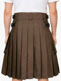 Brown pleated skirt with black buckles worn by a person on a white background