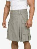 Man wearing a gray kilt with chains on a white background