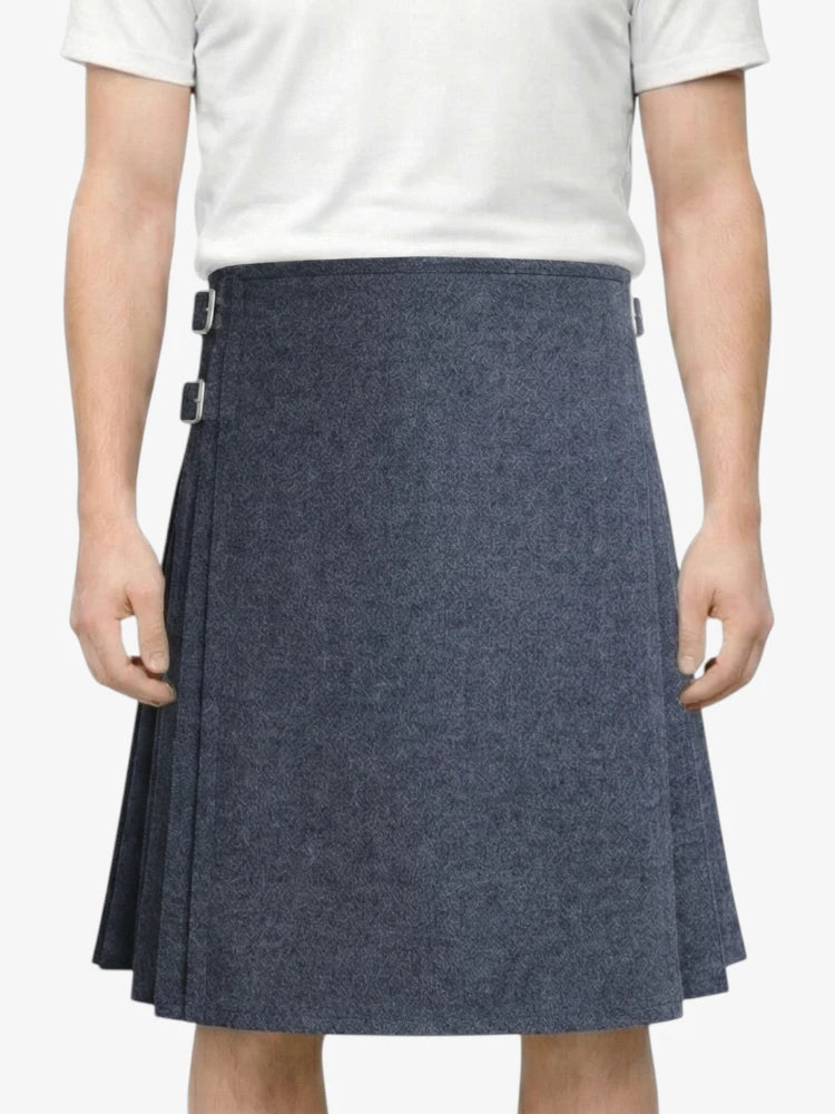 Person wearing a gray pleated skirt on a white background