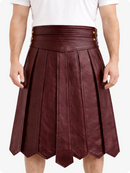 Maroon leather skirt worn by a person on a white background