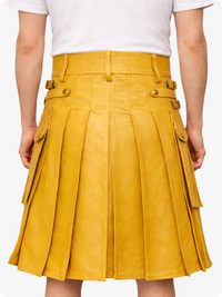 Yellow pleated skirt worn by a person on a white background