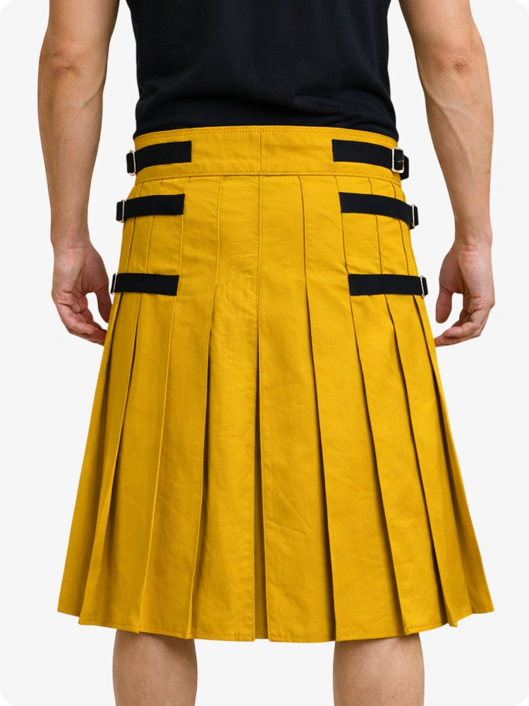 Mustard Yellow pleated kilt with black straps on a white background
