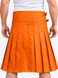 Orange pleated skirt worn by a person on a white background