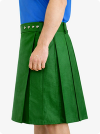Standard Green skirt with pleated design worn by a person, on a white background
