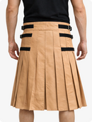 Tan pleated skirt with black accents worn by a person on a white background